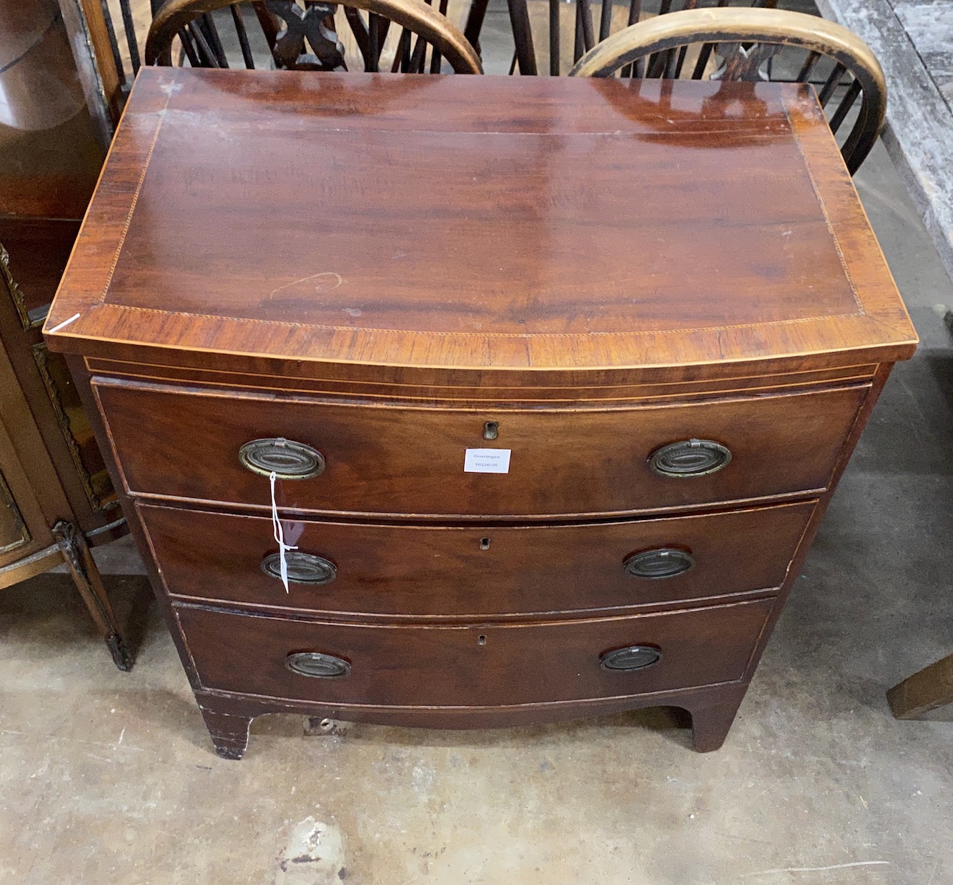 A small Regency banded and inlaid mahogany bow fronted chest of drawers, width 74cm, depth 45cm, height 81cm